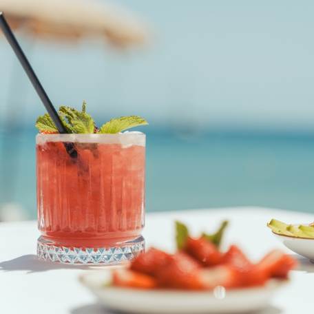 Tropicana Ibiza red cocktail with view of sea